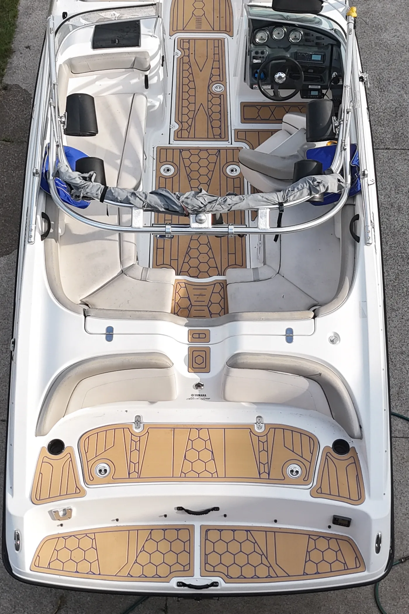 A 2012 Yamaha AR210 seen straight down from above, with tan hex and plank flooring in the cockpit and on the swim platform
