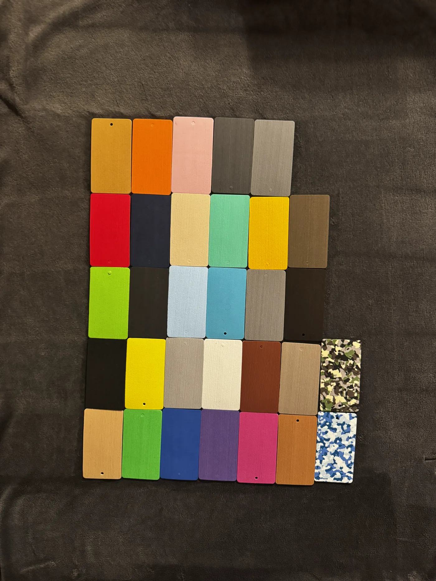 Foam sample chips laid out on dark cloth